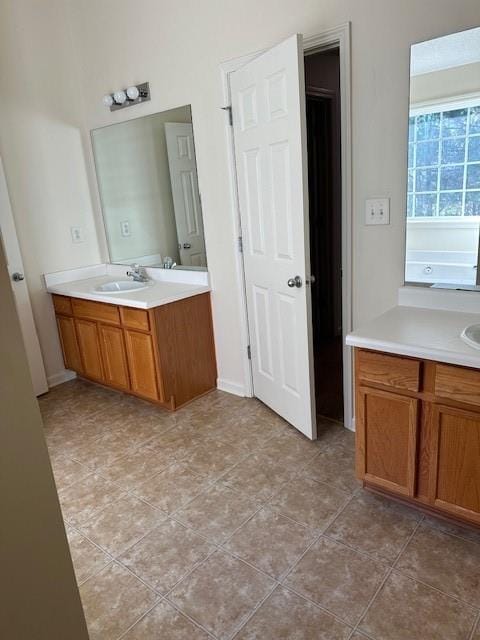 635 Beddick Ln, Atlanta, GA 30349 - full bath featuring vanity and tile patterned flooring