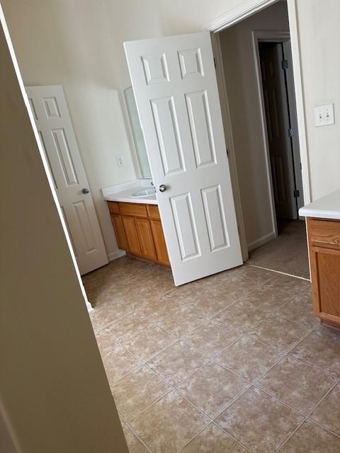 635 Beddick Ln, Atlanta, GA 30349 - bathroom with vanity, tile patterned flooring, and baseboards