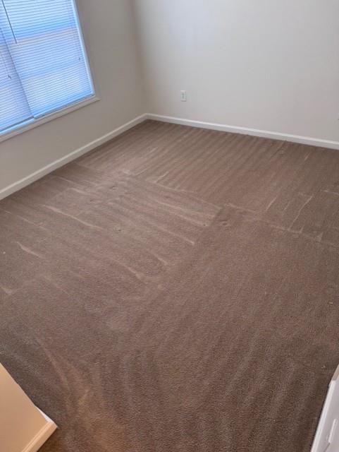635 Beddick Ln, Atlanta, GA 30349 - unfurnished room featuring carpet floors and baseboards