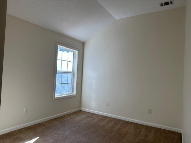 635 Beddick Ln, Atlanta, GA 30349 - carpeted spare room featuring vaulted ceiling and baseboards