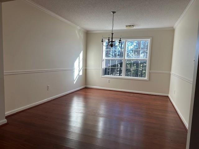635 Beddick Ln, Atlanta, GA 30349 - unfurnished dining area with a chandelier, ornamental molding, wood finished floors, a textured ceiling, and baseboards