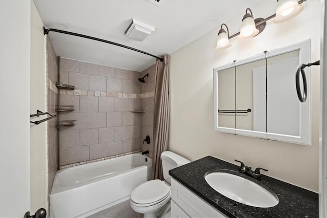 full bathroom featuring vanity, toilet, and tiled shower / bath