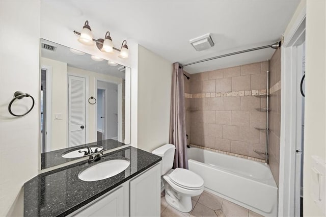 full bathroom featuring vanity, toilet, tile patterned floors, and shower / bath combo with shower curtain