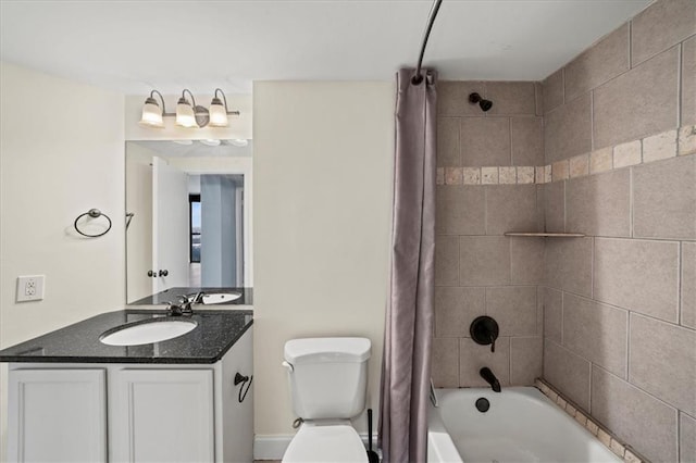 full bathroom with vanity, shower / bath combination with curtain, and toilet