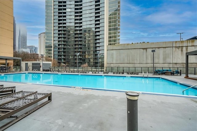 view of swimming pool featuring a patio