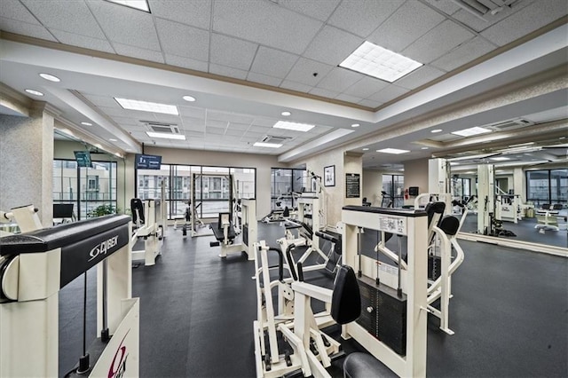 gym featuring a paneled ceiling