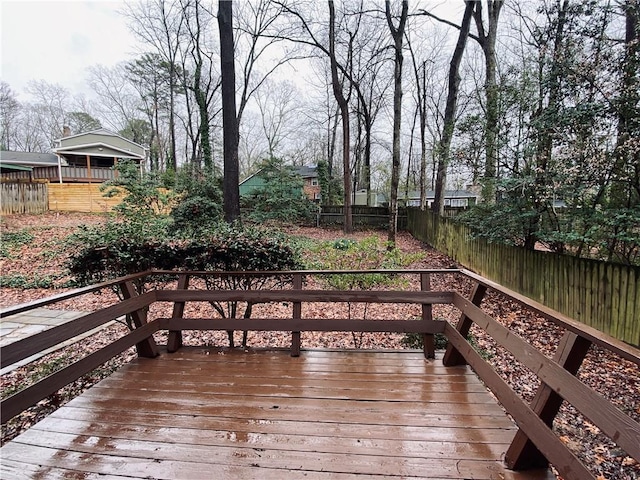 wooden deck featuring fence