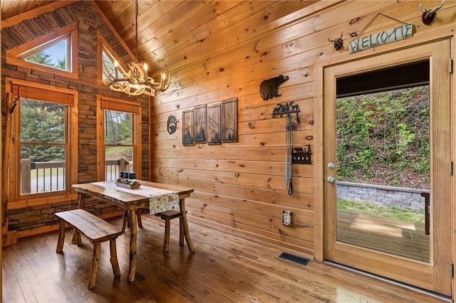 744 Old Loving Rd, Morganton, GA 30560 - dining area with a chandelier, wood walls, hardwood / wood-style floors, wooden ceiling, and lofted ceiling
