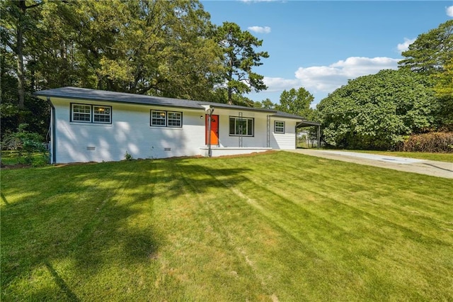 ranch-style home with a front lawn