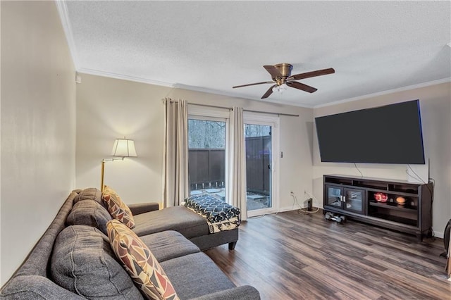 living room featuring a textured ceiling, wood finished floors, a ceiling fan, and crown molding