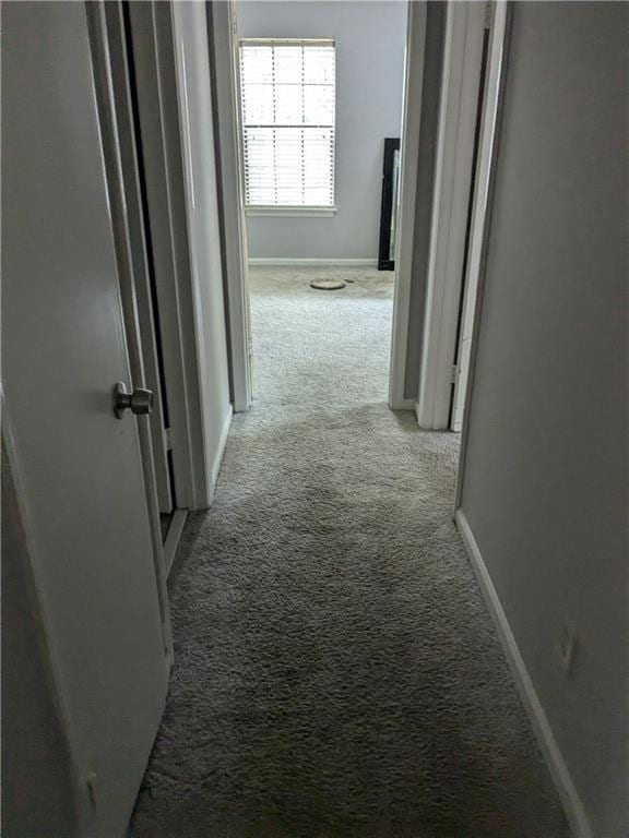 hall with light carpet and baseboards