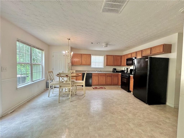 105 Avonwood Cir, Locust Grove, GA 30248 - kitchen with black appliances, plenty of natural light, a chandelier, and brown cabinetry