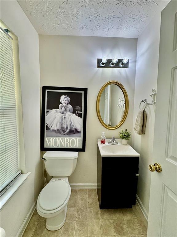 105 Avonwood Cir, Locust Grove, GA 30248 - bathroom featuring vanity and tile patterned floors