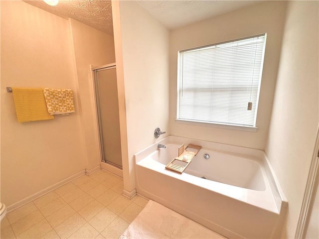 105 Avonwood Cir, Locust Grove, GA 30248 - full bathroom featuring a stall shower, a bath, and tile patterned flooring