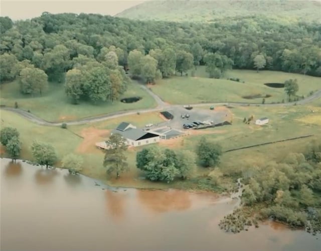 aerial view with a water view and a rural view