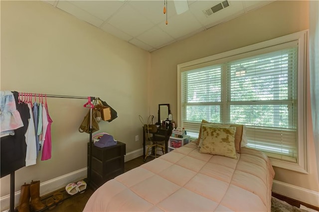 bedroom with dark wood-type flooring and ceiling fan