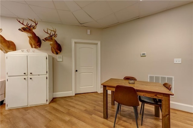 dining area with light hardwood / wood-style floors