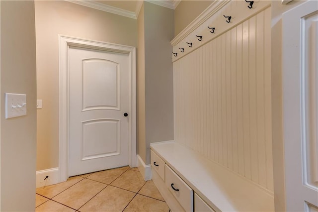 mudroom featuring light tile patterned floors and ornamental molding