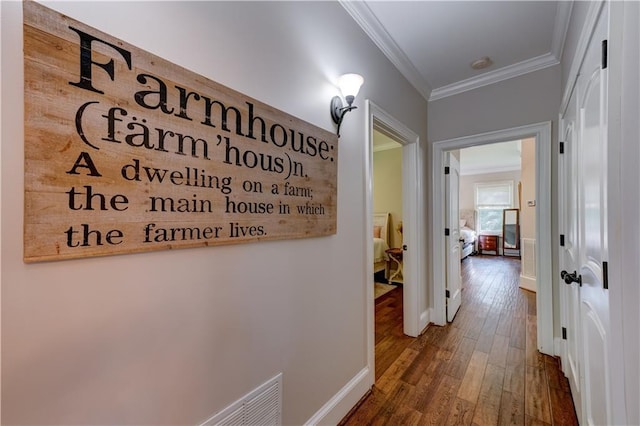 hall featuring dark hardwood / wood-style floors and crown molding