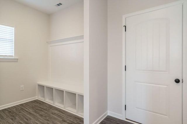 mudroom featuring dark wood-style floors, visible vents, and baseboards