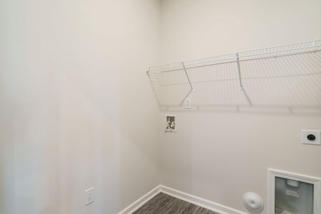 laundry area with hookup for a washing machine, baseboards, dark wood finished floors, laundry area, and electric dryer hookup