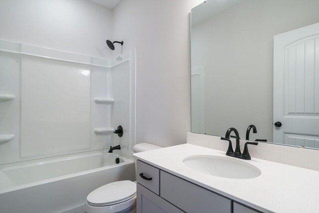 full bath with toilet, vanity, and shower / bathing tub combination