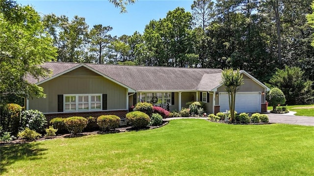 103 Mims Dr, Calhoun, GA 30701 - ranch-style home featuring brick siding, driveway, an attached garage, a front lawn, and a shingled roof