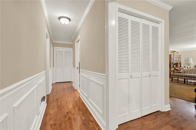 103 Mims Dr, Calhoun, GA 30701 - hall featuring ornamental molding, wood finished floors, a wainscoted wall, and a decorative wall
