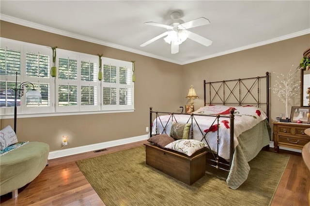 103 Mims Dr, Calhoun, GA 30701 - bedroom with wood finished floors, ornamental molding, baseboards, and ceiling fan