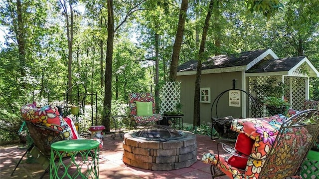 103 Mims Dr, Calhoun, GA 30701 - view of patio / terrace featuring a fire pit and an outbuilding