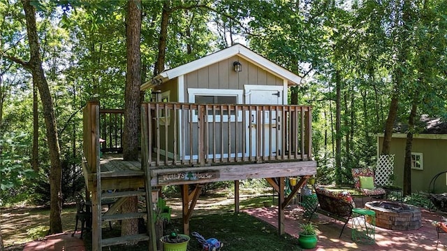 103 Mims Dr, Calhoun, GA 30701 - view of outdoor structure featuring an outdoor fire pit
