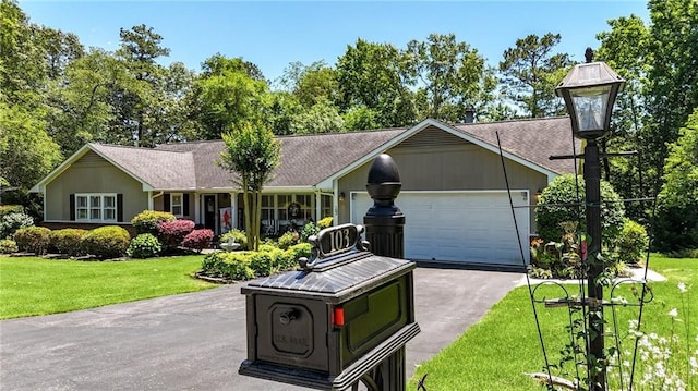 103 Mims Dr, Calhoun, GA 30701 - single story home with a front yard, driveway, and a garage
