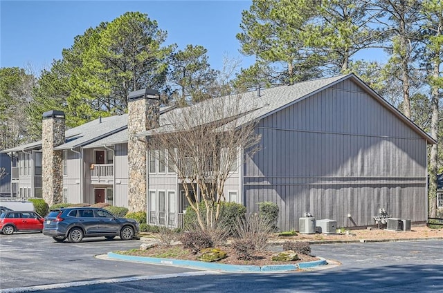 view of property featuring uncovered parking