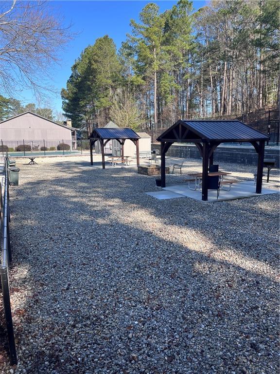 view of community with a gazebo and fence