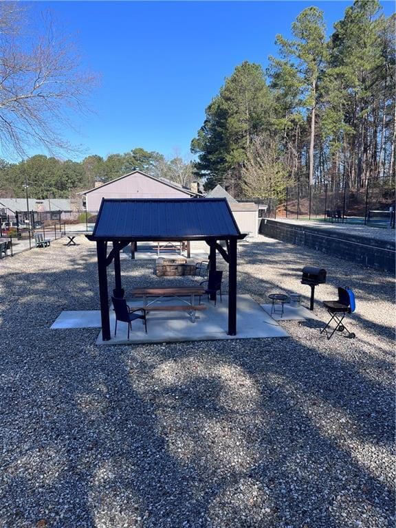 view of community with a gazebo and fence