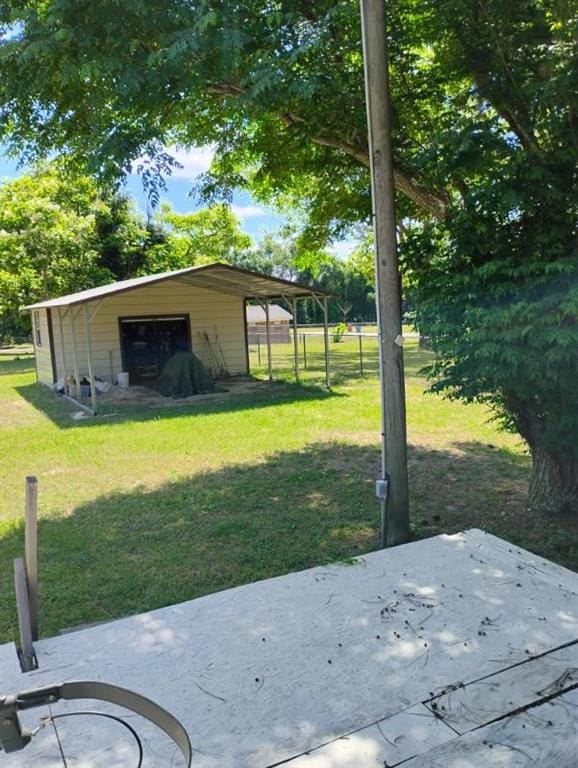 137 Timber Ln, Waycross, GA 31503 - view of grassy yard with a garage and an outbuilding