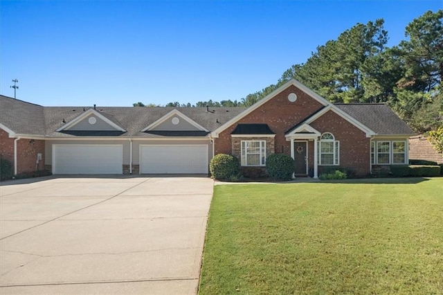 ranch-style house featuring a front lawn and a garage