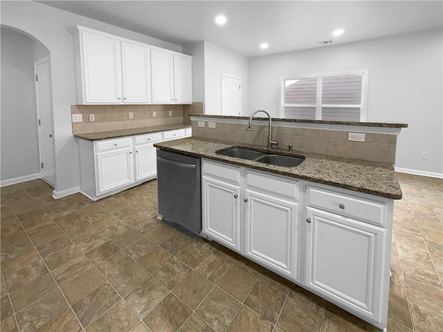 kitchen featuring white cabinetry, stainless steel dishwasher, sink, and a center island with sink