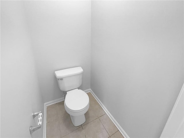 bathroom featuring toilet and tile patterned flooring