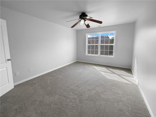 spare room with carpet floors and ceiling fan