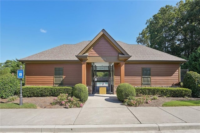 4430 Cedar Bridge Walk, Suwanee, GA 30024 - view of front facade with a gate and roof with shingles