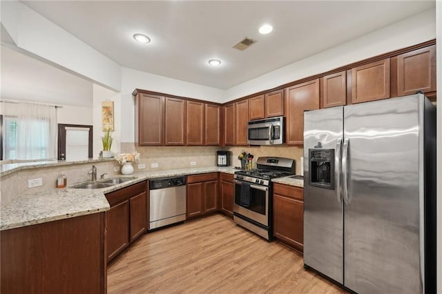 4430 Cedar Bridge Walk, Suwanee, GA 30024 - kitchen featuring light stone counters, tasteful backsplash, stainless steel appliances, and a sink