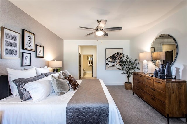 carpeted bedroom featuring ceiling fan and ensuite bathroom