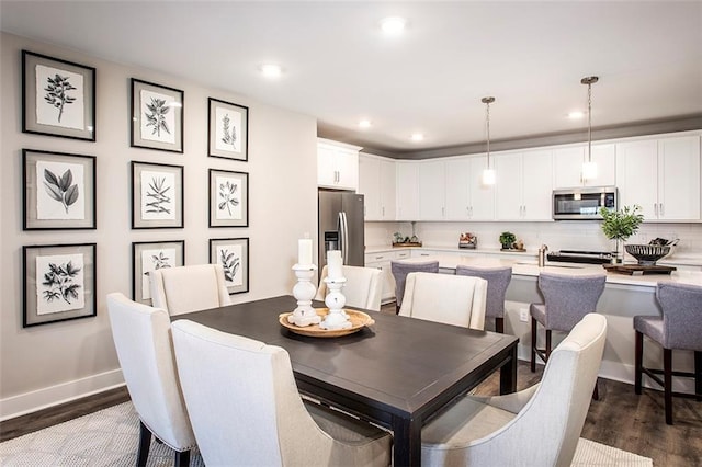 dining area featuring dark hardwood / wood-style floors