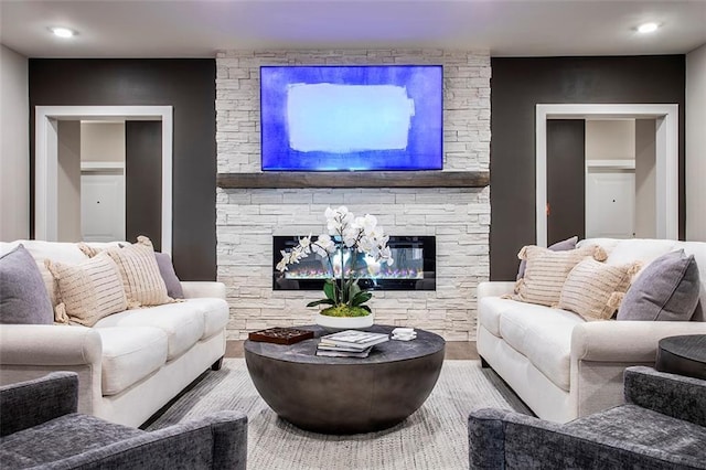 living room featuring hardwood / wood-style floors and a fireplace