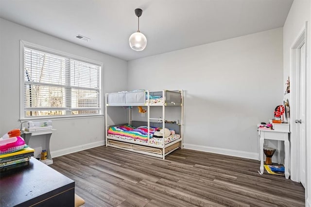 bedroom featuring dark wood-type flooring