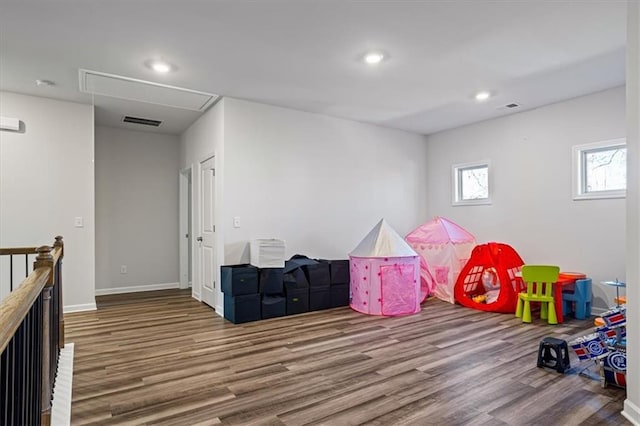 recreation room with wood-type flooring