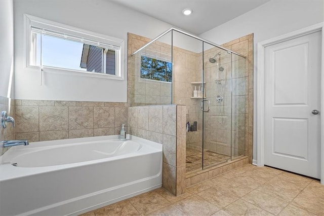 bathroom with tile patterned floors and plus walk in shower