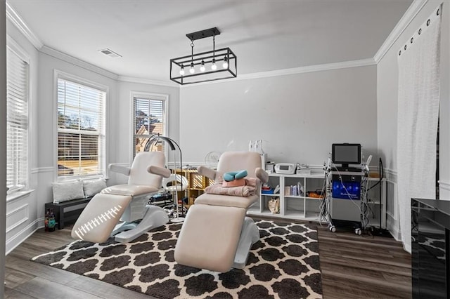 living area featuring ornamental molding and dark wood-type flooring