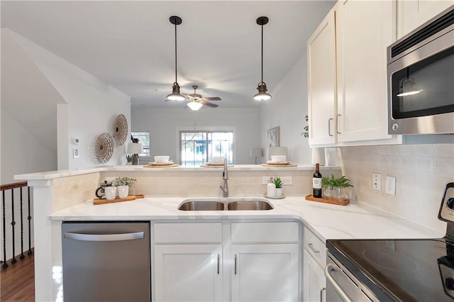 kitchen featuring sink, white cabinets, and stainless steel appliances